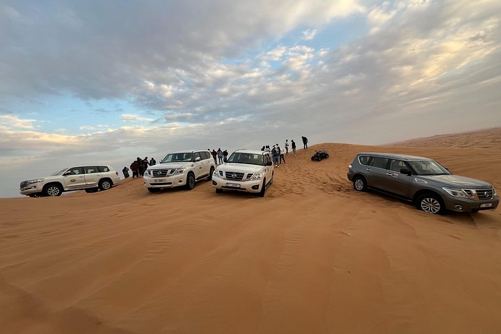 Red Dune Desert Safari Camel Ride, Sandboarding with BBQ Dinner